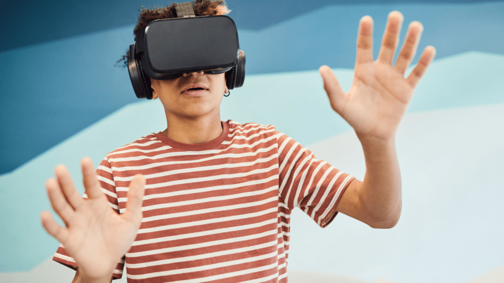 A boy in virtual reality through VR Goggles